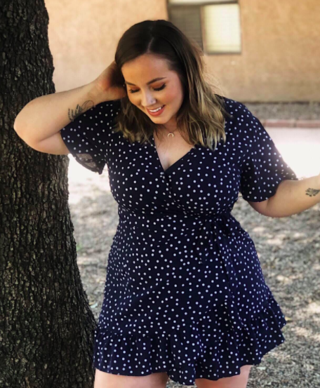 A customer-submitted image of the V-neck dress in a vibrant blue shade.