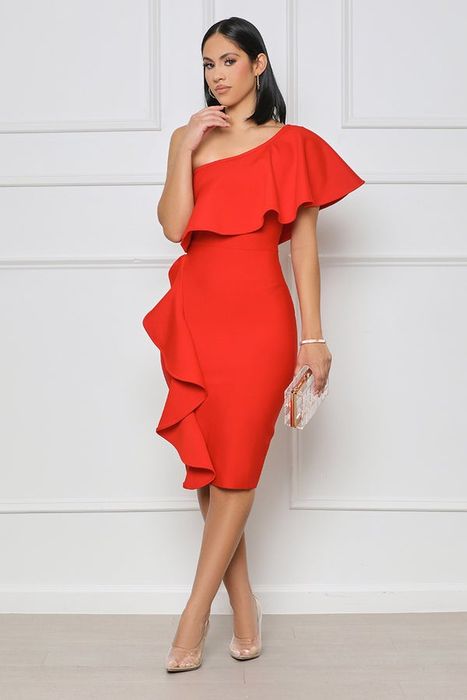 A model showcasing a striking red one-shoulder dress, falling just below the knee.