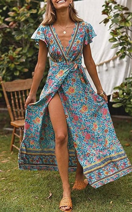 a model wearing a blue floral maxi wrap dress