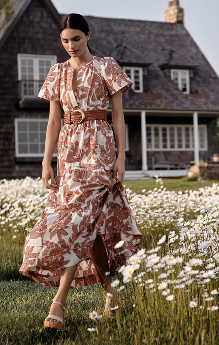 model standing in a field of wildflowers