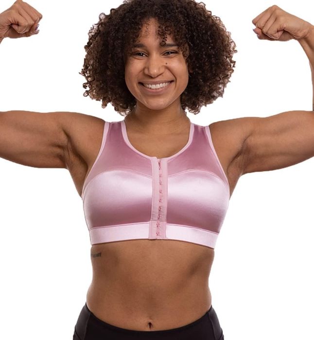 A model is showcasing the pink bra in the image.