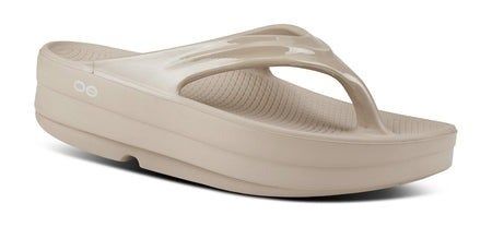 A single platform sandal with soft cushioning and a wide strap over the top, designed for ultimate comfort and casual wear.