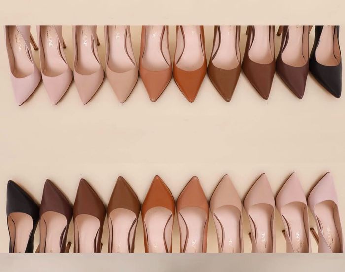 Rows of high-heeled shoes in various shades, perfect for showcasing footwear diversity in a shopping article