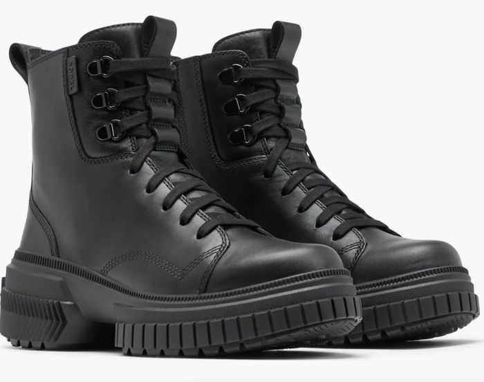 A pair of black leather combat boots with sturdy, rugged soles and lace-up fronts, shown from a side view