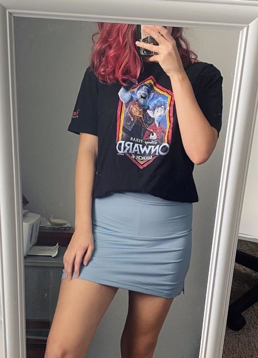 A reviewer takes a mirror selfie wearing a black