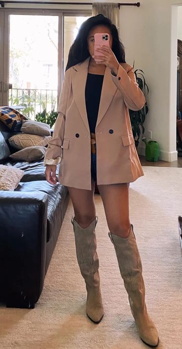 A reviewer styling the tan blazer