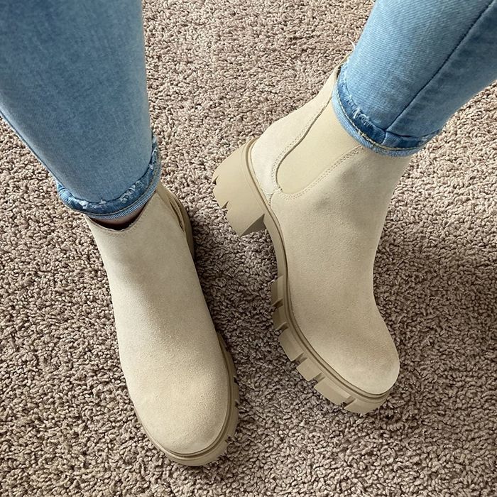 Reviewer showcasing the boots