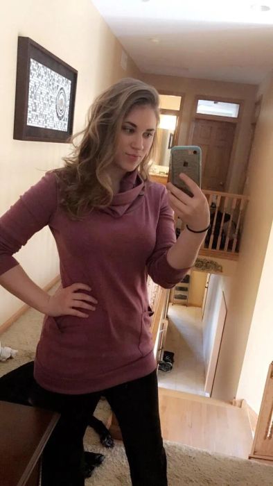 Reviewer wearing the purple top