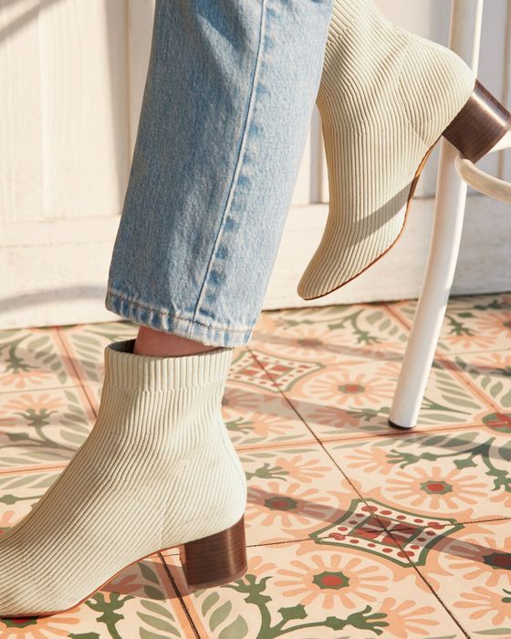 Model wearing the white boots