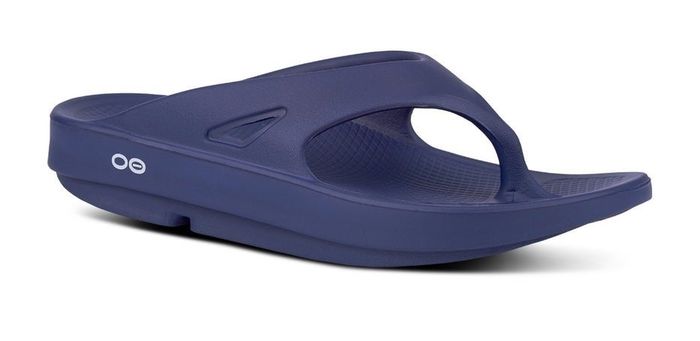A modern, minimalist flip-flop with a sturdy sole and a textured footbed, perfect for relaxed and stylish everyday wear.