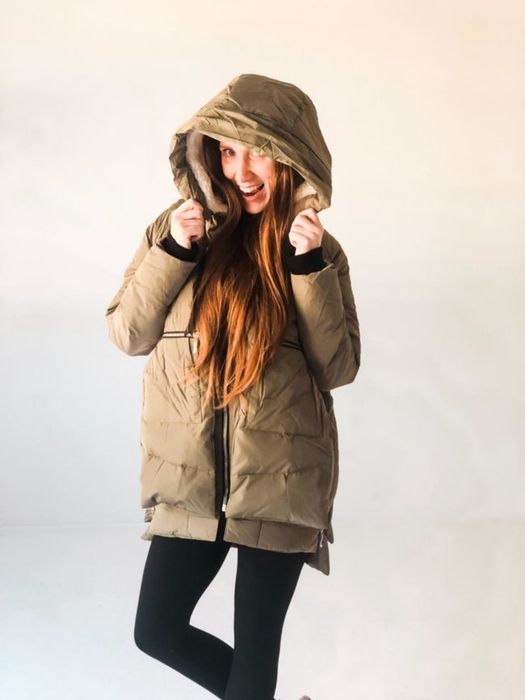 Reviewer sporting the olive green hooded jacket