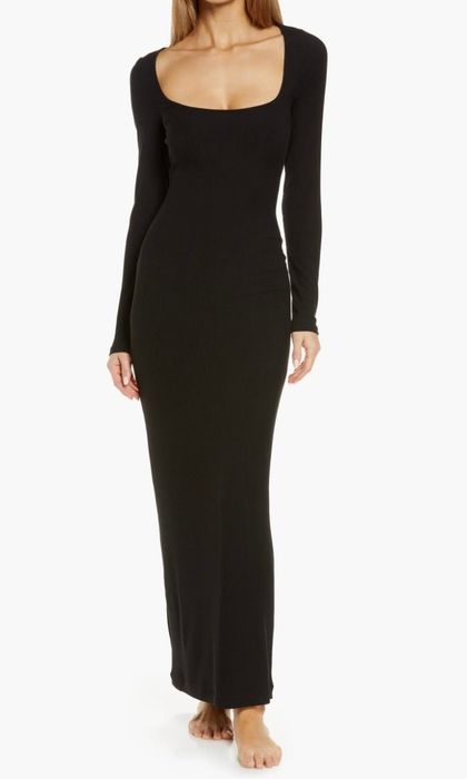 A model showcasing the black dress