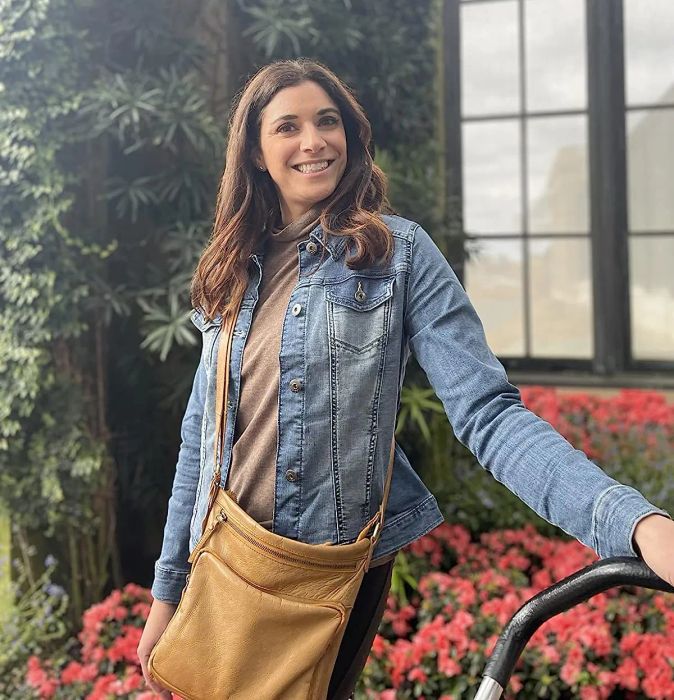 Reviewer styling the blue jean jacket with a brown top