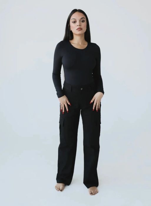 Model showcasing the black cargo pants