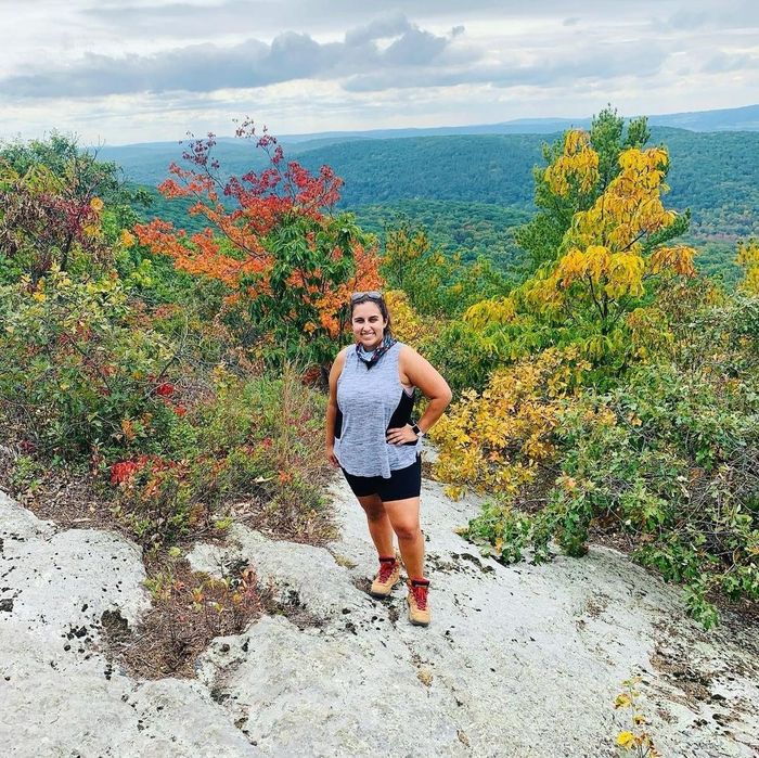 Writer showcasing the hiking boots during an autumn hike