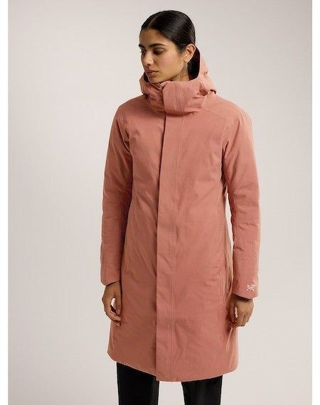 Model showcasing the orange version of the parka.