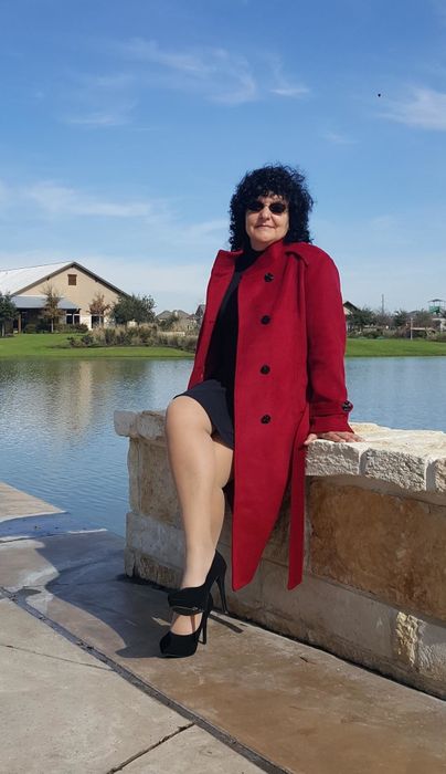 Reviewer showcasing the coat in red