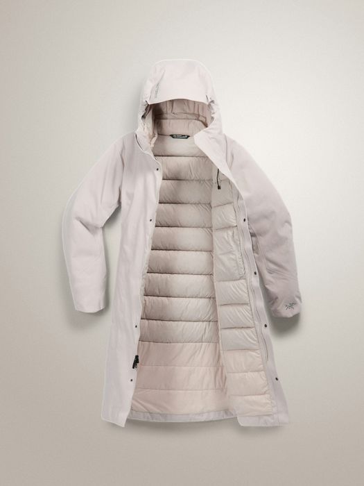 A long, hooded, off-white winter coat with a quilted lining, opened to reveal its insulating layers. Perfect for frigid conditions.