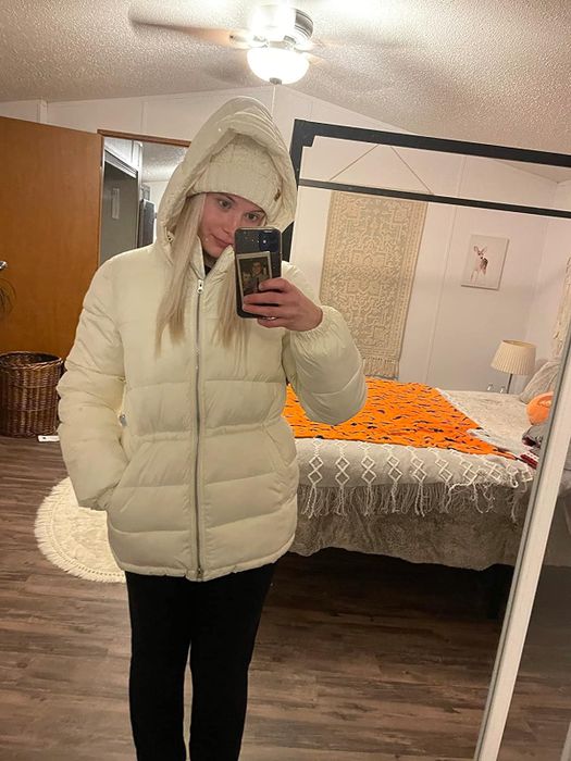 A reviewer wearing the jacket in white.
