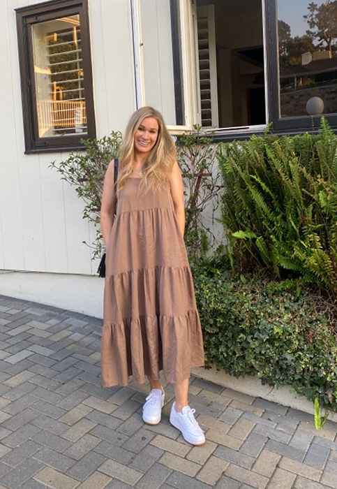 A reviewer wearing the tan maxi dress