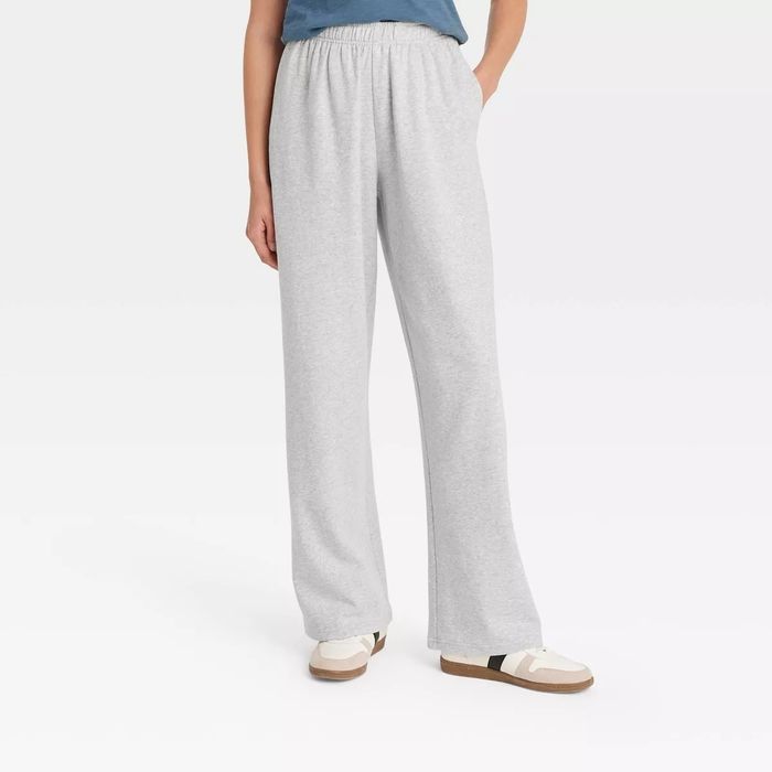 A model wearing relaxed, casual gray lounge pants.
