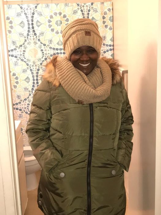 Reviewer wearing the jacket in green