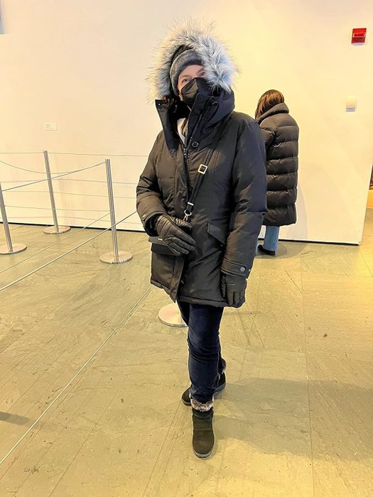 Reviewer wearing the jacket in dark green