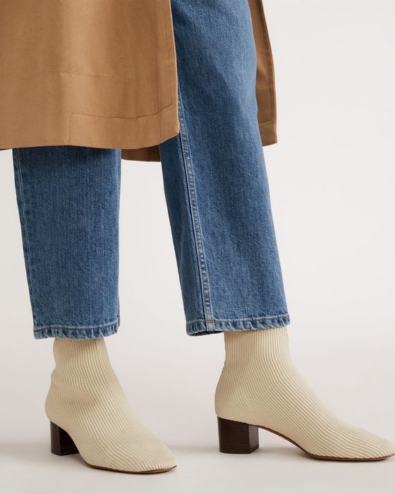 Model showcasing the white boots