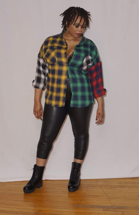 reviewer in a yellow, red, white, and green colorblock flannel