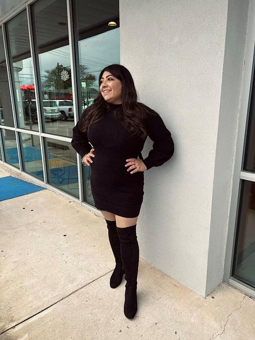 reviewer showcasing the boots in black