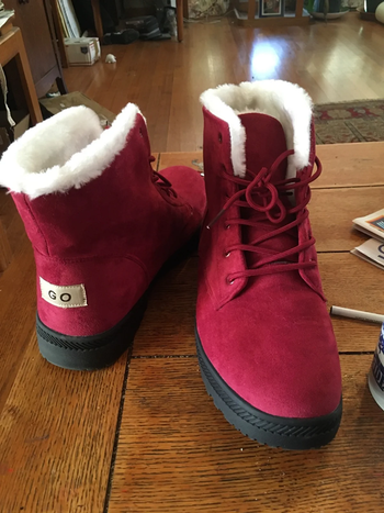 A reviewer shares a photo of their red boots.