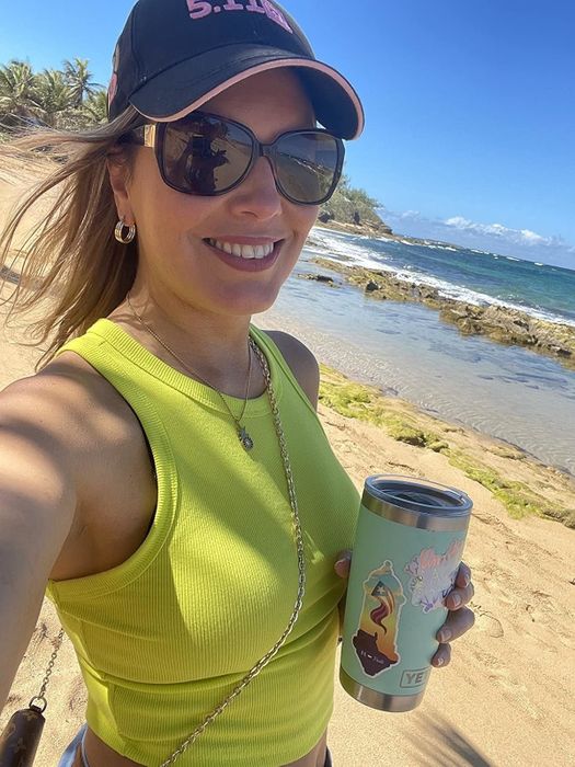 A reviewer modeling the neon green top