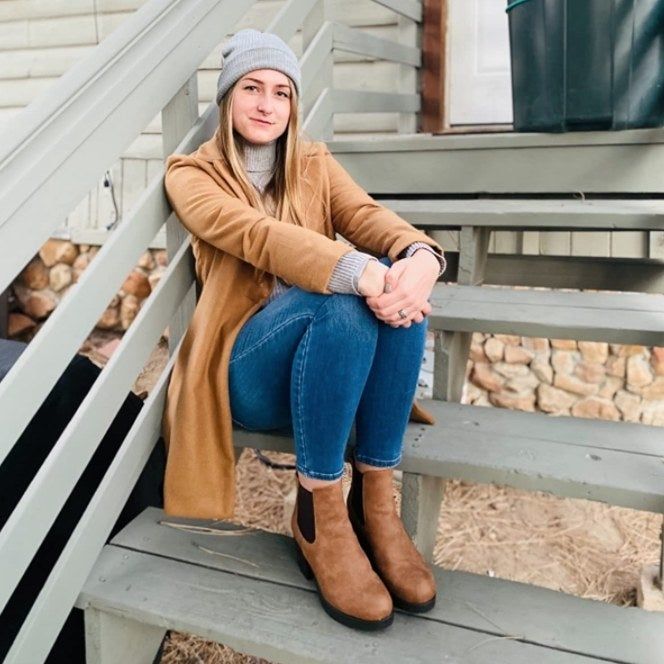 A reviewer wearing the boots.