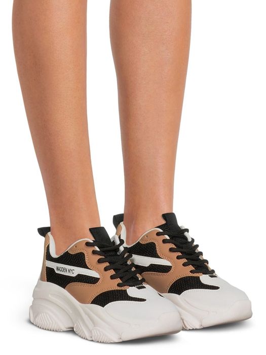 A pair of Madden NYC sneakers featuring a chunky sole and a mix of white, black, and tan panels