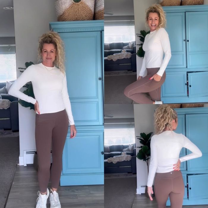 A reviewer modeling the brown leggings