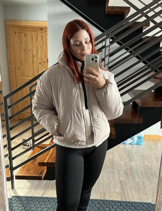 A reviewer wearing the apricot jacket