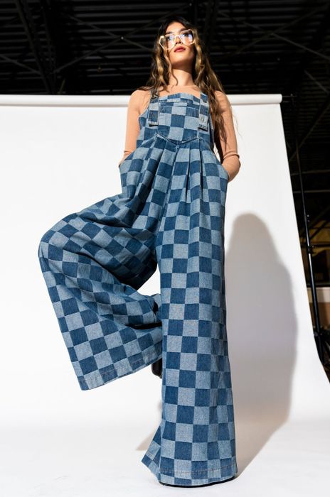 model in the blue ultra-wide-leg overalls