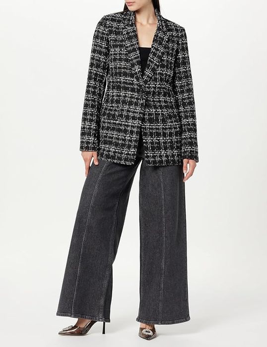 model showcasing the black and white boucle design