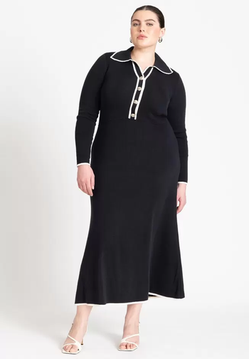 model in a black long-sleeve midi dress with white piping
