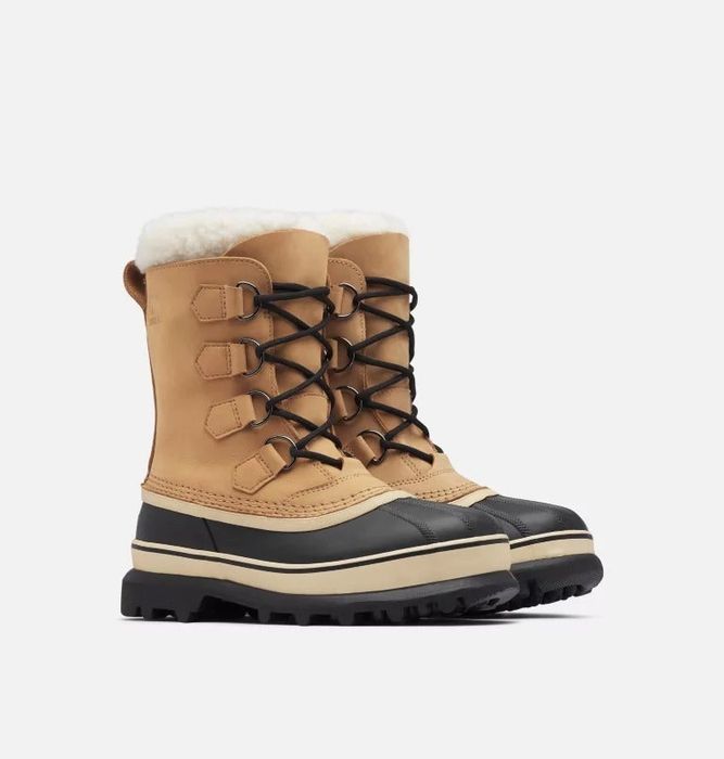 the snow boots in black and tan