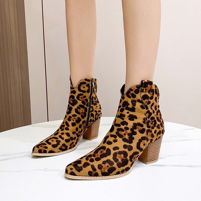 Leopard print ankle boots with block heels showcased on a white background