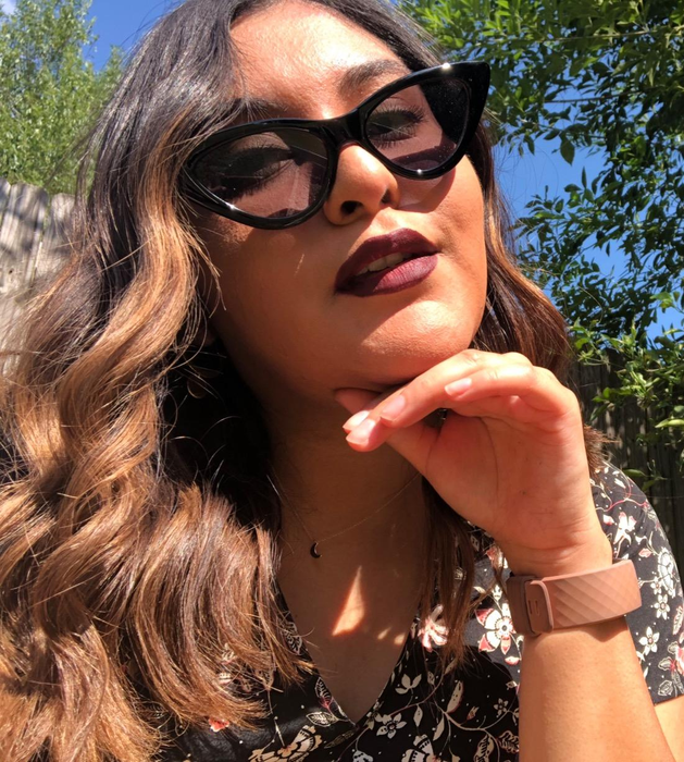 reviewer styling the black sunglasses