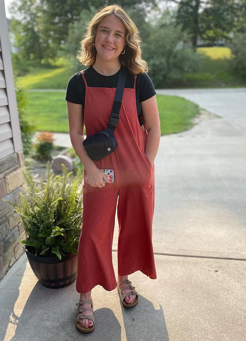 another reviewer wearing the rust-colored jumpsuit