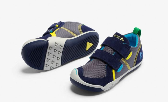 The blue, grey, and yellow sneakers