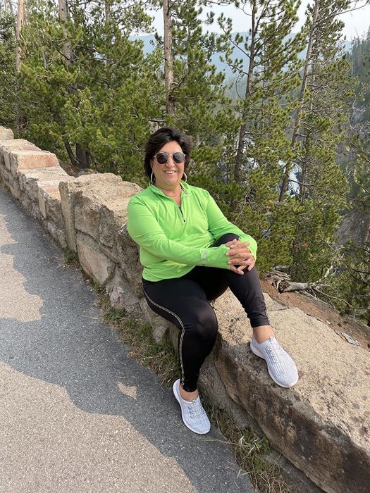 A reviewer wearing the same sneakers during an outdoor stroll