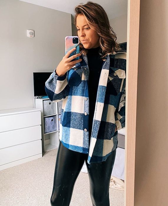 another reviewer wearing the blue and white plaid shacket