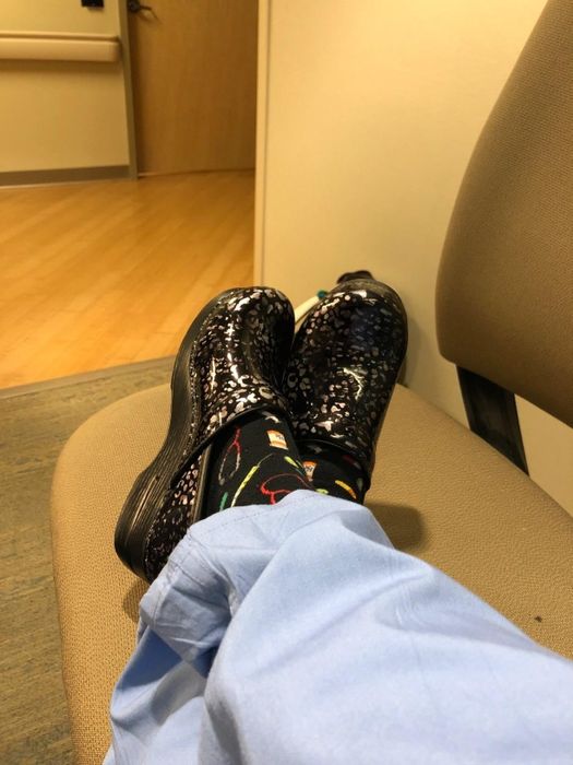 A reviewer wearing clogs