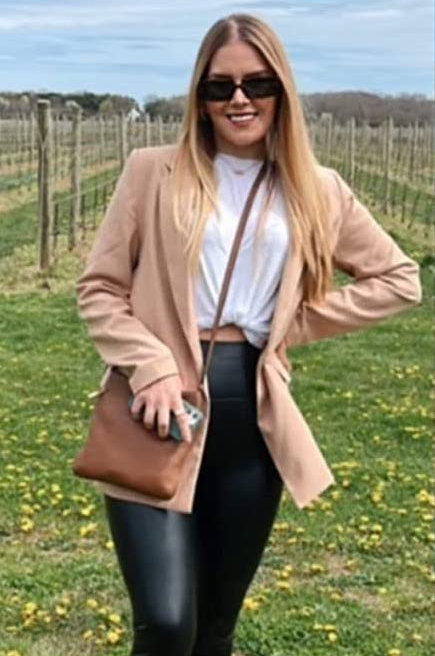 another reviewer showcasing the tan blazer paired with black pants