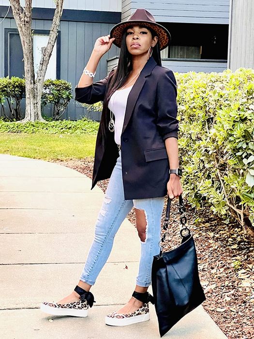 reviewer styling the black blazer with jeans