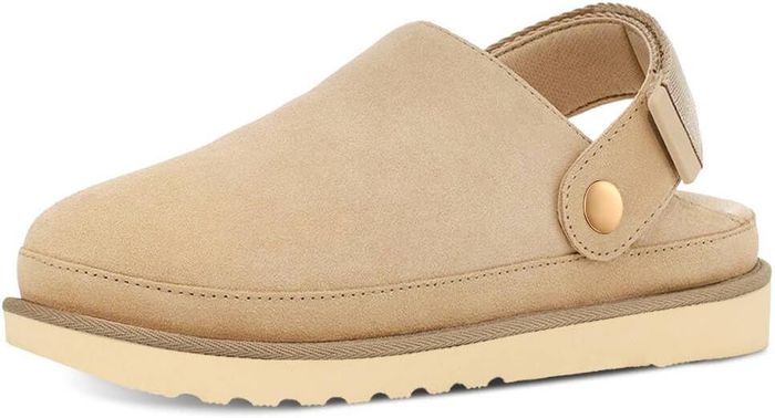 Tan suede clogs featuring an adjustable back strap and a durable rubber sole, perfect for casual wear and outdoor activities.